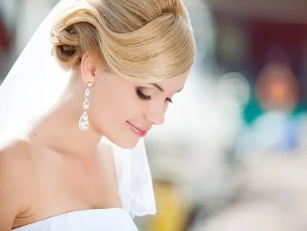 Bride with glowing skin on her wedding day after following the right skincare timeline.