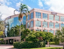 The Hollywood office building, a pink and glass office tower among palm trees