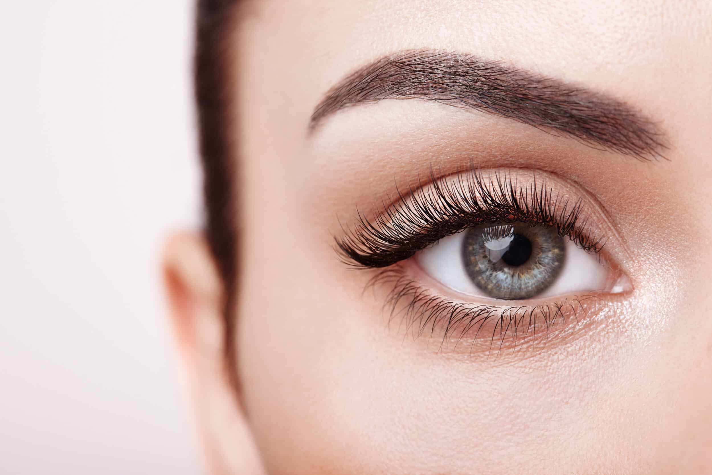 Close-up of woman's eye with beautiful long lashes